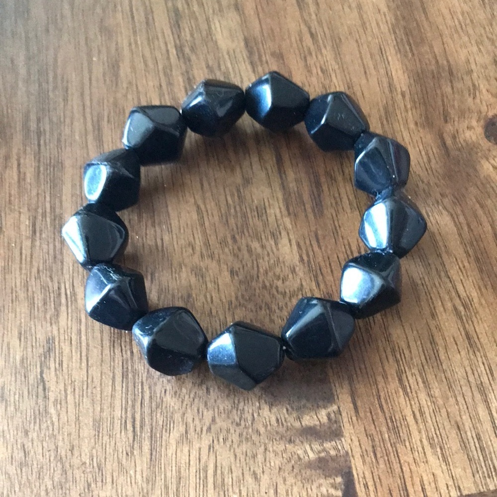 A black nugget like bracelet.. in good condition